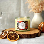 Comfy Cozy candle in clear glass jar and gold lid