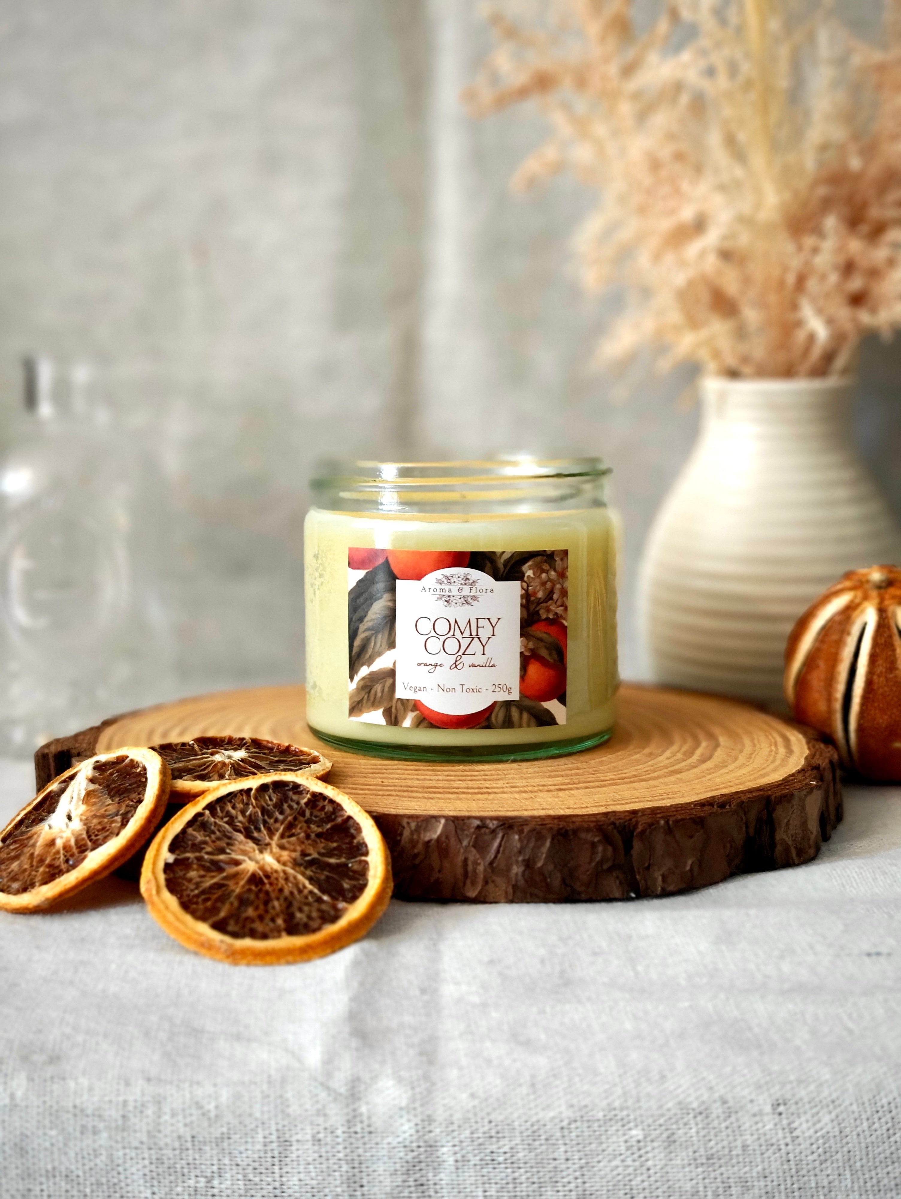 Comfy Cozy candle in clear glass jar and gold lid